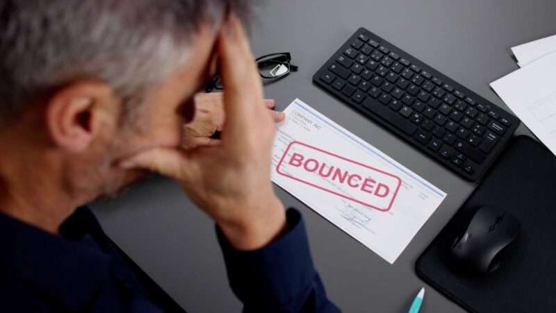  stressed person with bounced check