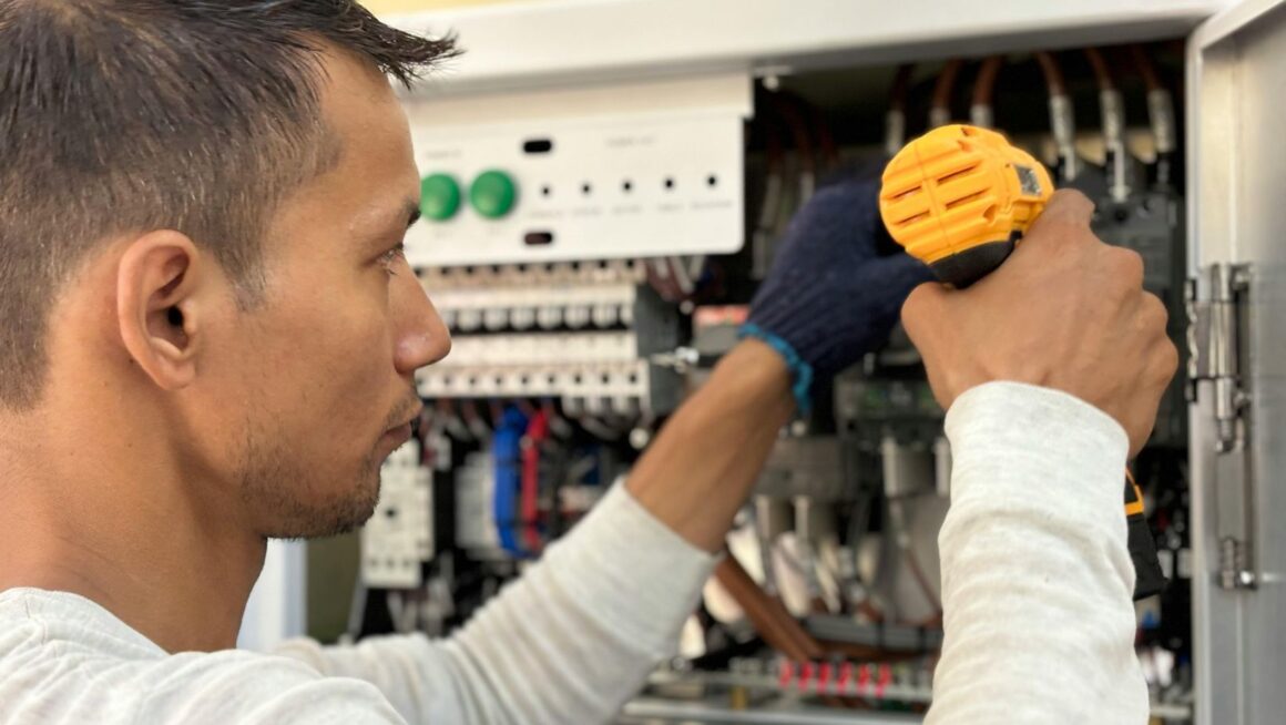 Electrician using a tool