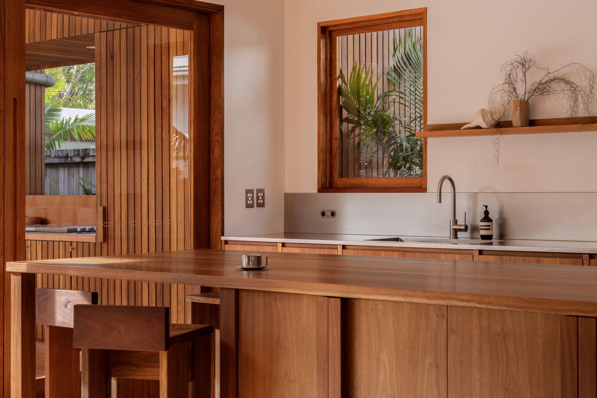 quiet luxury homes, material consistency homes, luxury home design trends, minimalist luxury residences, high-end home materials, understated luxury interiors, sustainable luxury houses, location-specific luxury homes, modern luxury architecture, premium material homes